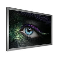 Designart 'Nő szeme zöld és lila pigment és szikrák modern keretes művészeti nyomtatása